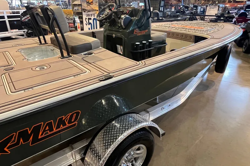 Slide: The Image of 2025 Mako 18 Pro Skiff Backwater Edition boat displayed indoors. - 3