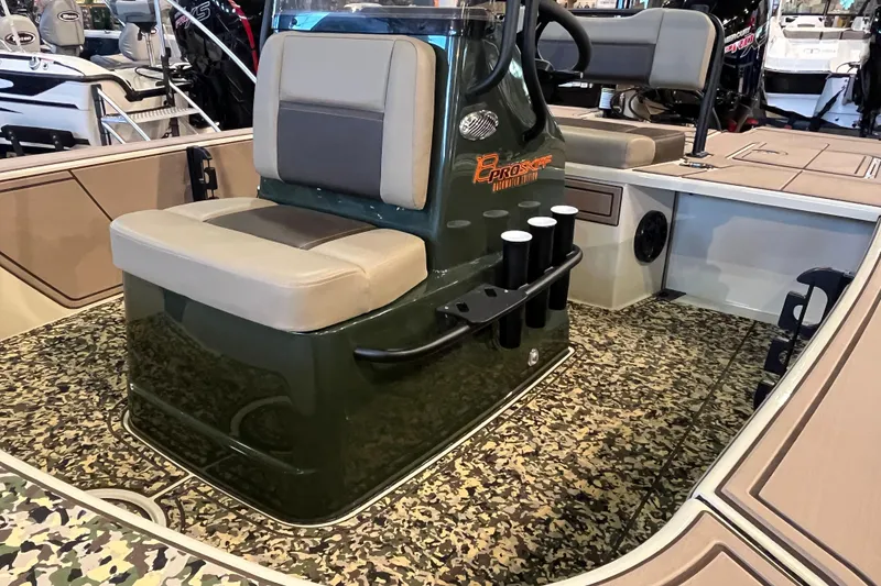 Slide: The Image of 2025 Mako 18 Pro Skiff Backwater Edition interior with camo flooring and seating. - 9
