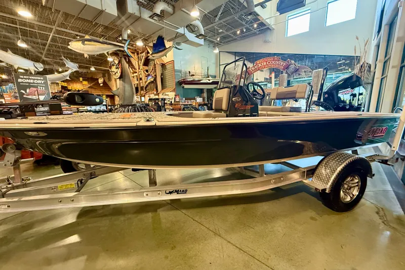 The Image of 2025 Mako 18 Pro Skiff Backwater Edition on display in a showroom. - 0