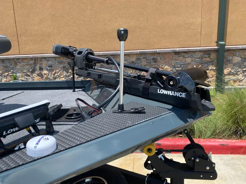 Slide: The Image of 2025 Ranger RT178 boat with Lowrance trolling motor, parked outdoors. - 4