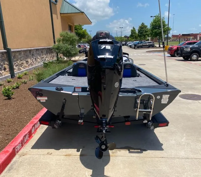 Slide: The Image of 2025 Ranger RT178 boat with Mercury 75 engine parked outdoors. - 7