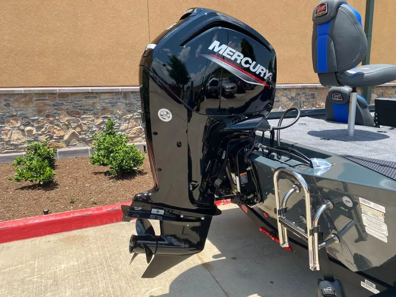 Slide: The Image of 2025 Ranger RT178 boat with Mercury outboard motor, parked on concrete near a stone wall. - 8