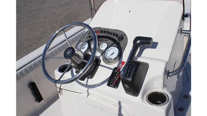 Slide: The Image of 2025 Carolina Skiff 21 LS boat console with steering wheel and controls. - 13