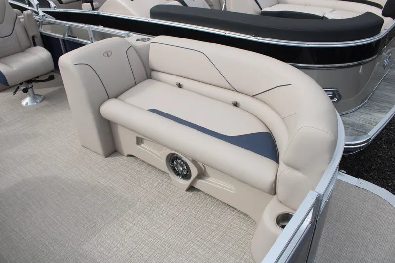 Slide: The Image of 2024 Tahoe Pontoon Sport 2385 QL interior seating with beige upholstery and cup holder. - 3