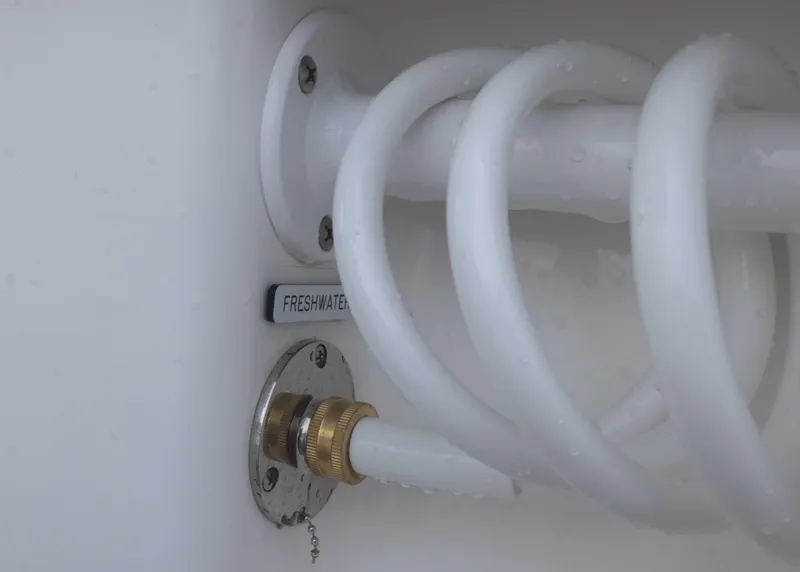 Slide: The Image of Freshwater hose connection on 2023 Invincible 33 Catamaran. - 21