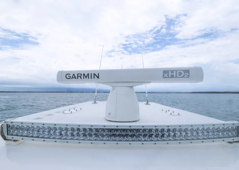 Slide: The Image of 2023 Invincible 33 Catamaran with Garmin xHD2 radar on open water. - 24