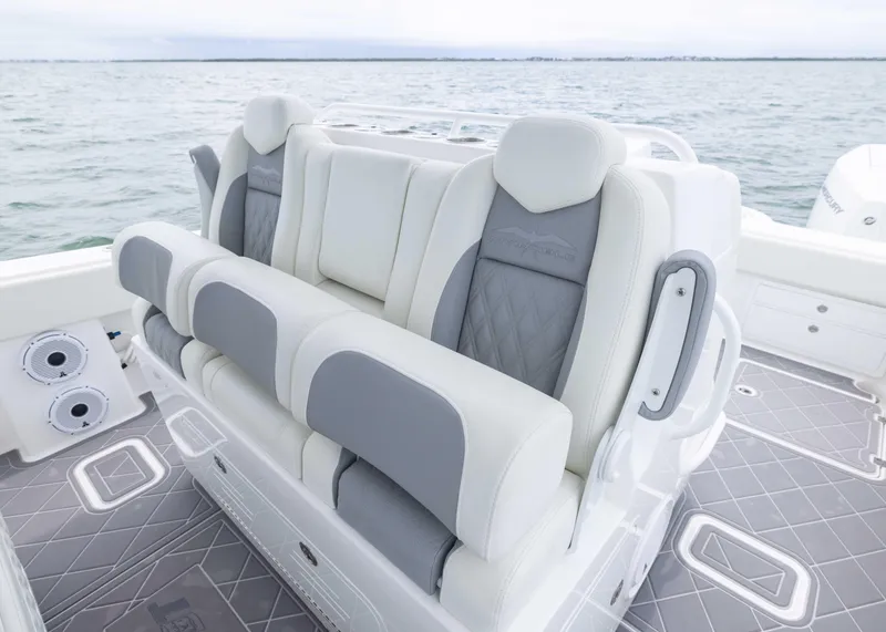 Slide: The Image of Luxury seating on 2023 Invincible 33 Catamaran, featuring elegant gray and white upholstery. - 28