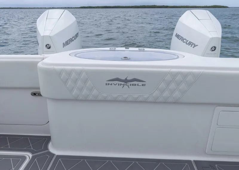 Slide: The Image of 2023 Invincible 33 Catamaran with Mercury engines on open water. - 36