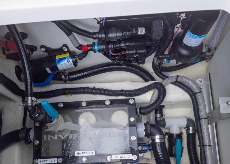 Slide: The Image of 2023 Invincible 33 Catamaran engine compartment with wiring and components. - 42