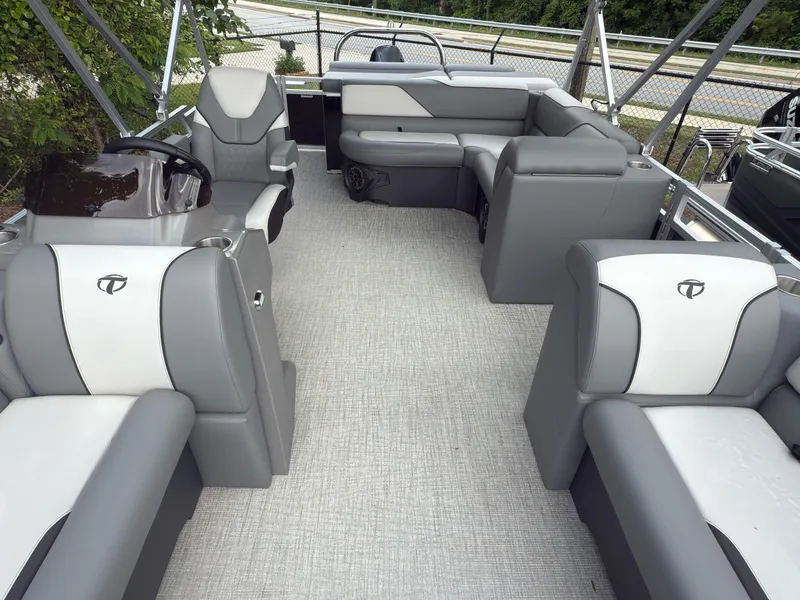 Slide: The Image of 2024 Tahoe Pontoon Sport Cruise interior with gray seating and modern design. - 4