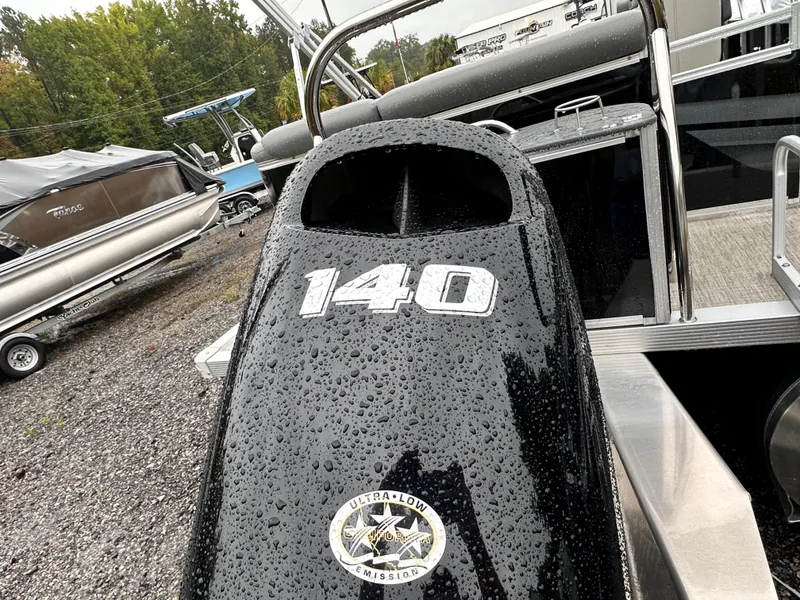 Slide: The Image of 2024 Tahoe Pontoon Sport Cruise with 140 engine, wet surface, parked outdoors. - 8