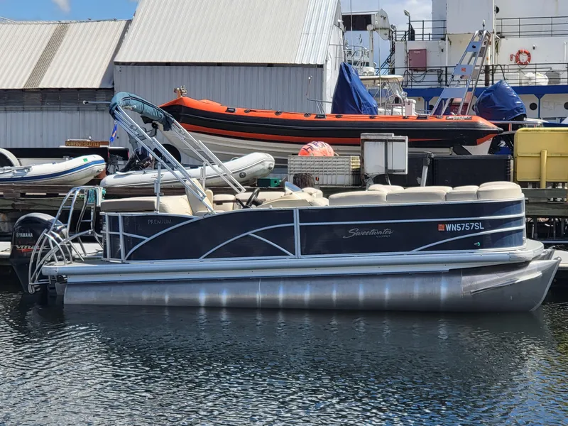 The Image of 2017 Godfrey Sweetwater 215c pontoon boat docked at a marina. - 1