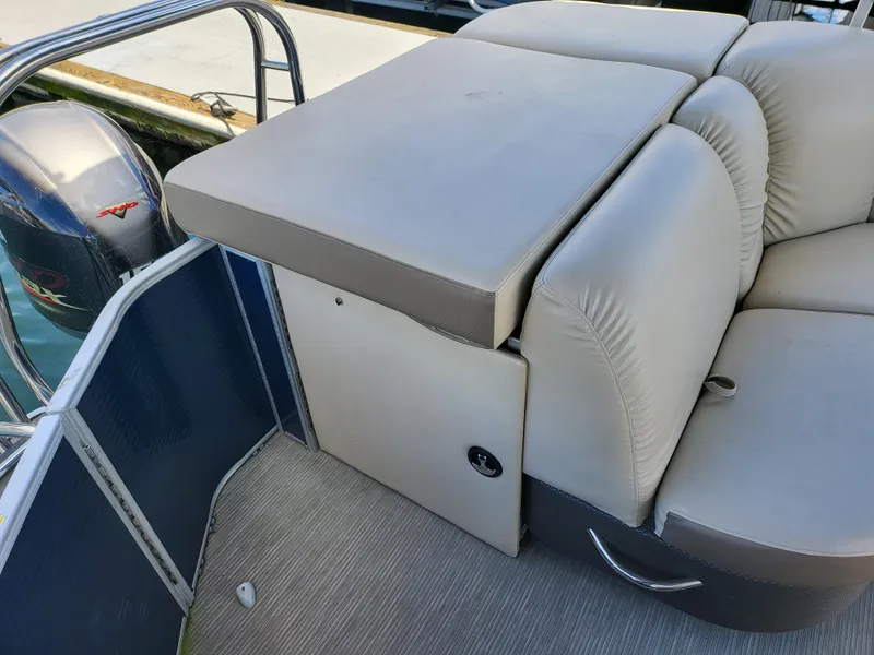 Slide: The Image of 2017 Godfrey Sweetwater 215c pontoon boat interior with cushioned seating and storage. - 13