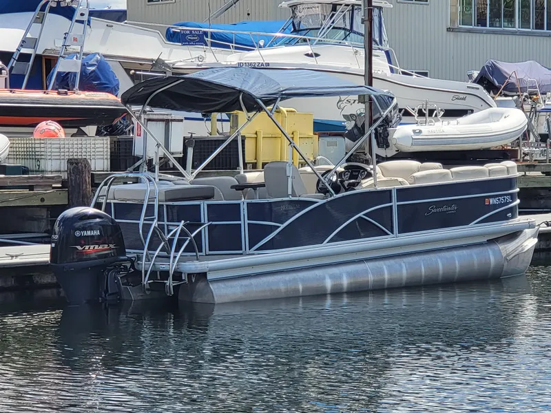 Slide: The Image of 2017 Godfrey Sweetwater 215c pontoon boat docked with Yamaha outboard motor. - 4