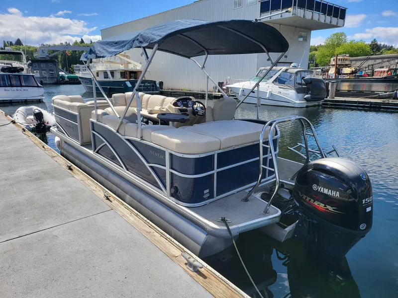Slide: The Image of 2017 Godfrey Sweetwater 215c pontoon boat docked with Yamaha outboard motor. - 5