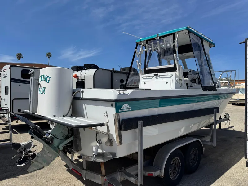 Slide: The Image of 2001 Davis 22 Cortez boat on trailer, outdoor setting, clear sky. - 1