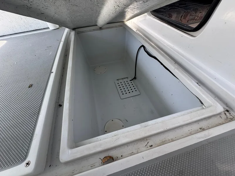 Slide: The Image of Open storage compartment on 2001 Davis 22 Cortez boat. - 14