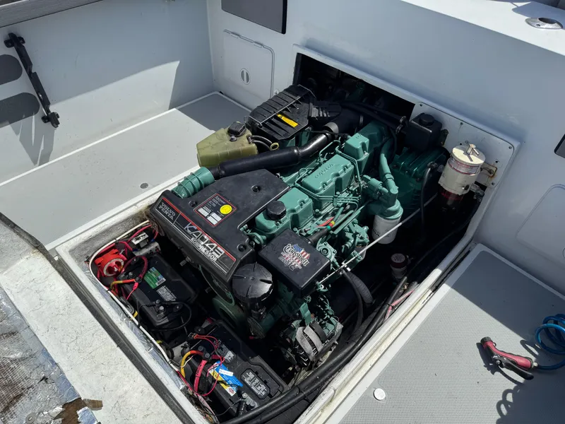 Slide: The Image of Engine compartment of a 2001 Davis 22 Cortez boat, showcasing detailed mechanical components. - 15