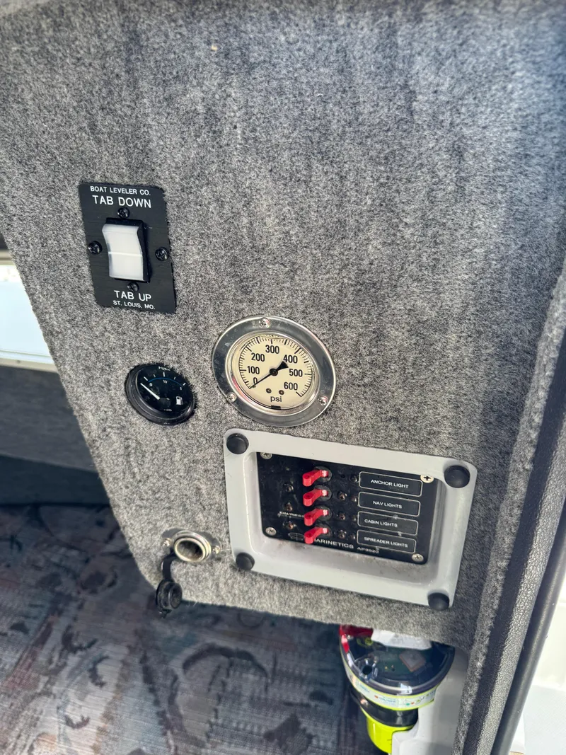 Slide: The Image of Control panel of a 2001 Davis 22 Cortez boat with switches and gauges. - 17