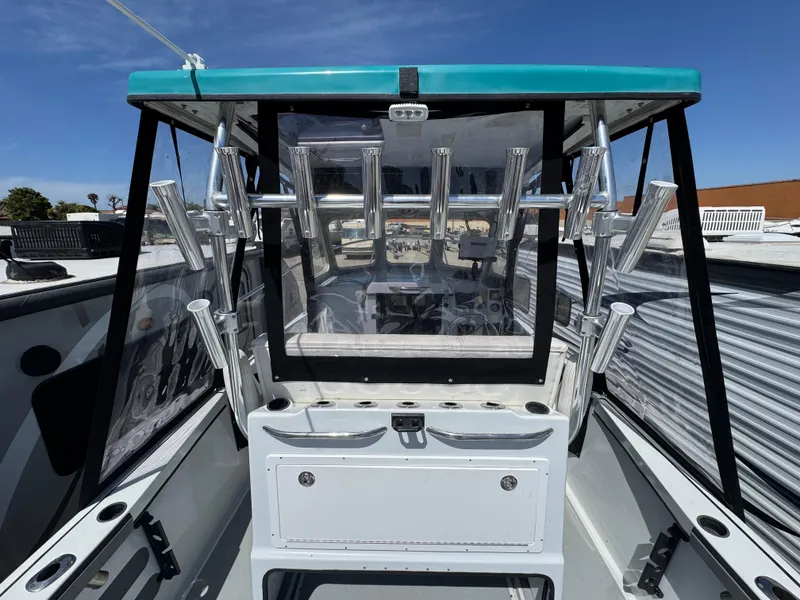 Slide: The Image of 2001 Davis 22 Cortez boat cockpit with rod holders and clear canopy. - 6