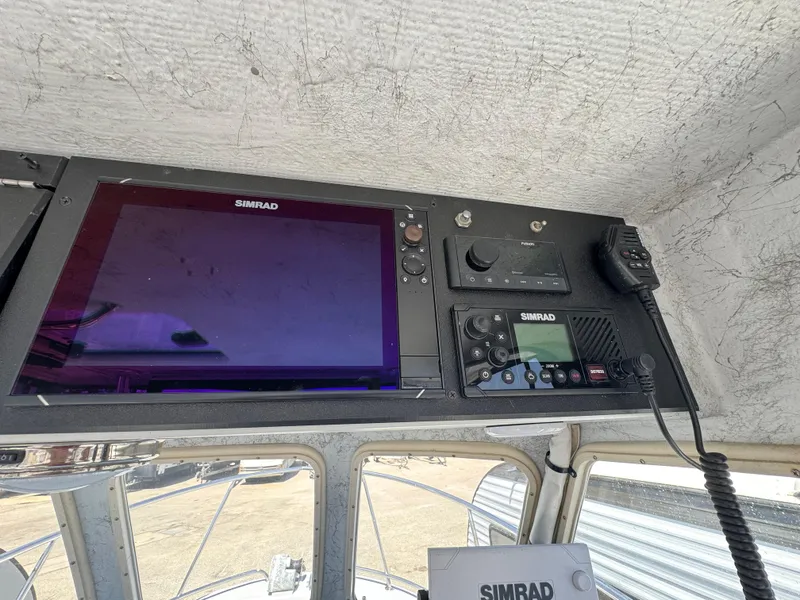 Slide: The Image of Control panel of a 2001 Davis 22 Cortez boat with Simrad electronics. - 9