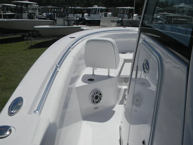 Slide: The Image of 2025 Sportsman Open 302 Center Console boat interior with seating and speakers. - 10