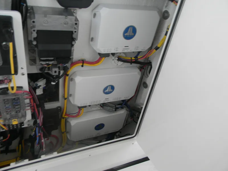 Slide: The Image of Electrical components inside a 2025 Sportsman Open 302 Center Console boat. - 17