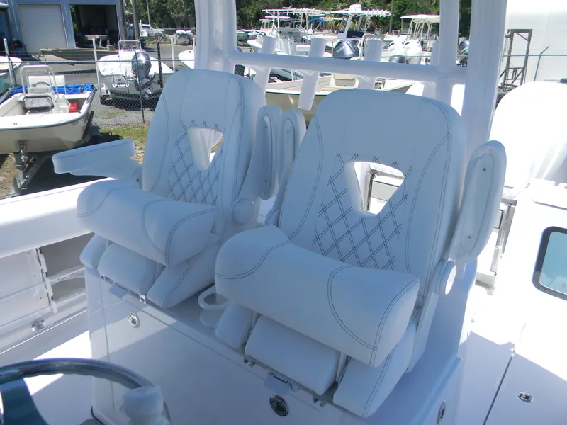 Slide: The Image of 2025 Sportsman Open 302 Center Console with luxurious white seating. - 22