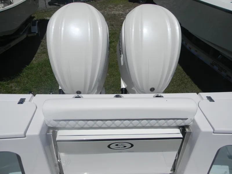 Slide: The Image of 2025 Sportsman Open 302 Center Console with dual outboard engines, rear view. - 6