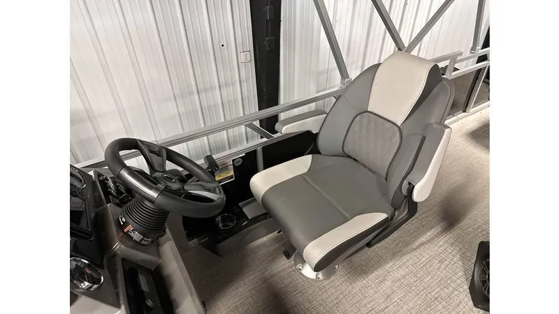 Slide: The Image of 2025 Tahoe Pontoon Sport 85 Rear Fish captain's chair and steering wheel. - 11