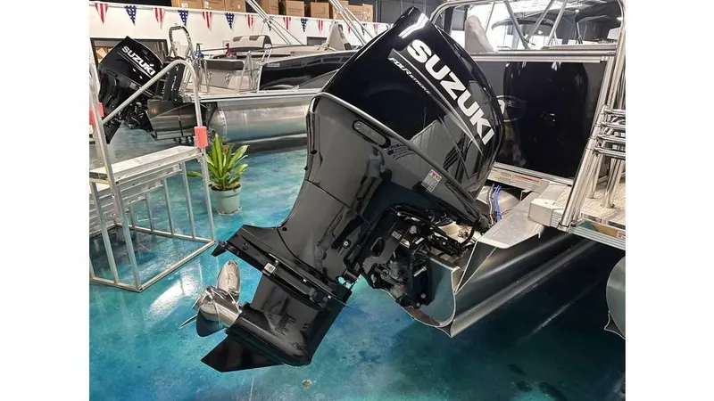 Slide: The Image of 2025 Tahoe Pontoon Sport 85 Rear Fish with Suzuki outboard motor in showroom. - 14