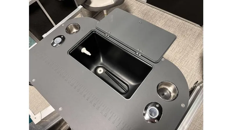 Slide: The Image of 2025 Tahoe Pontoon Sport 85 Rear Fish boat console with storage and cup holders. - 3