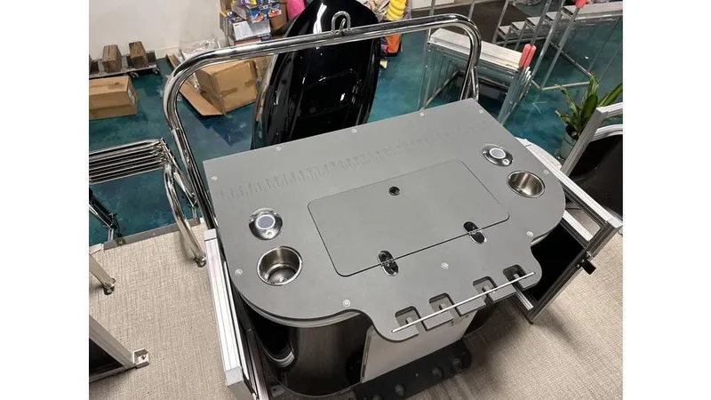 Slide: The Image of 2025 Tahoe Pontoon Sport 85 Rear Fish deck with cup holders and storage compartments. - 4
