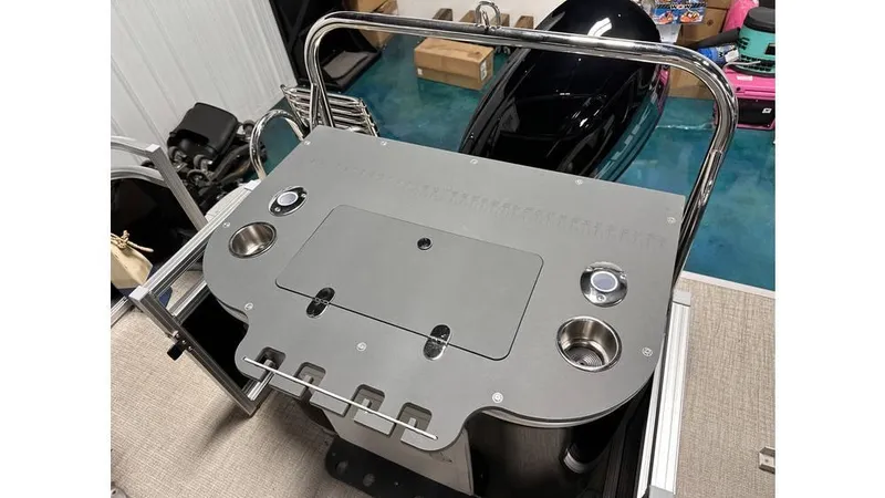 Slide: The Image of 2025 Tahoe Pontoon Sport 85 Rear Fish deck with cup holders and storage compartment. - 5