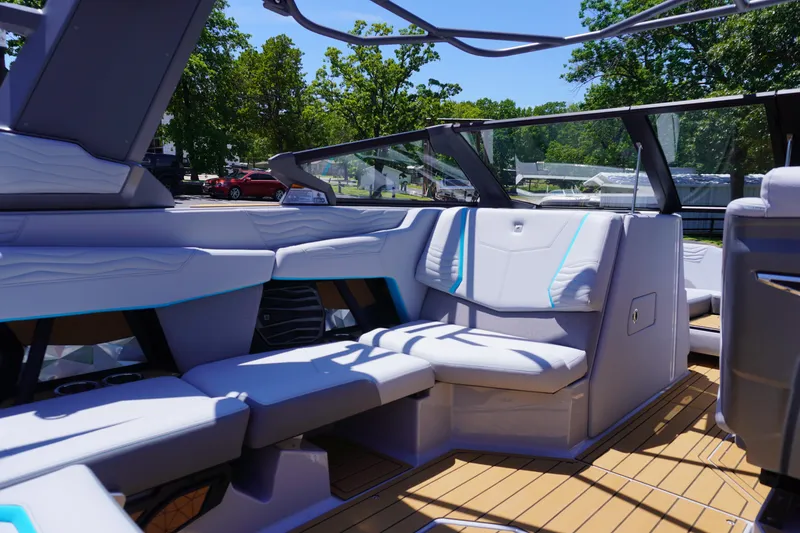 Slide: The Image of 2025 Nautique Super Air Nautique G21 interior with sleek seating and modern design. - 19
