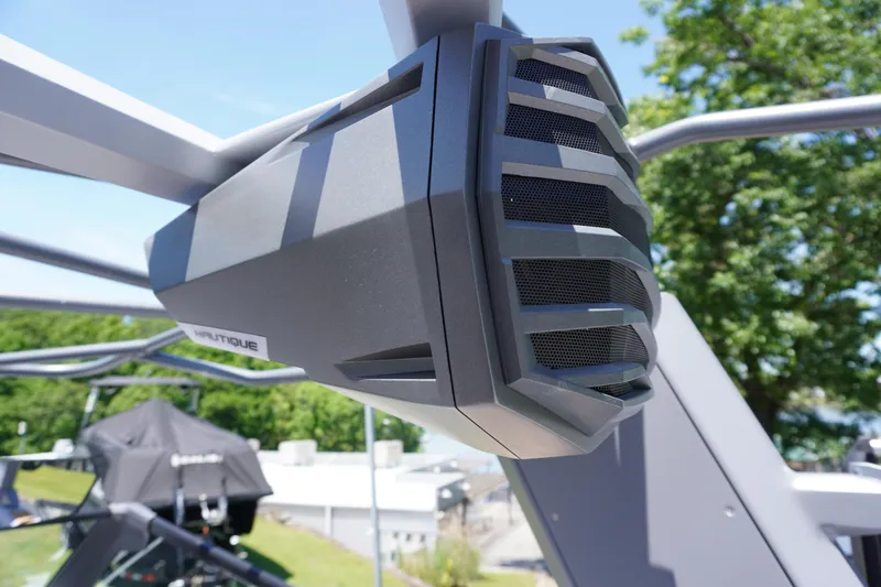 Slide: The Image of 2025 Nautique Super Air Nautique G21 boat speaker, close-up view, outdoors. - 20