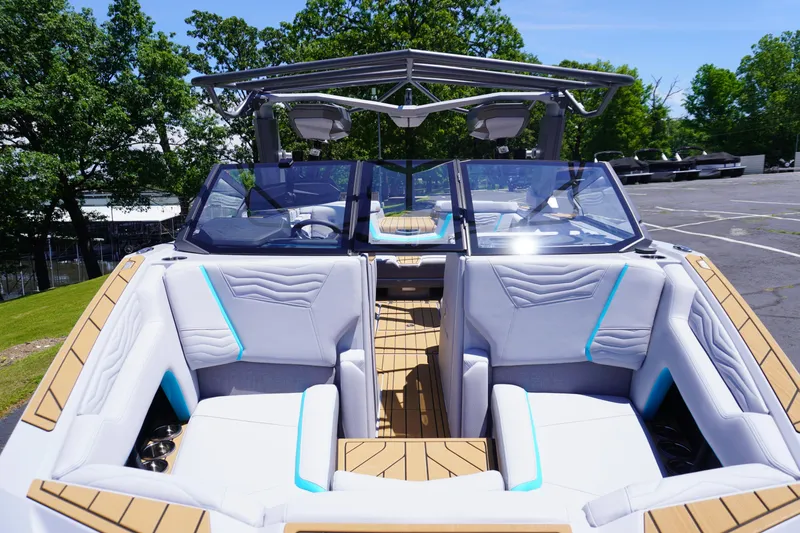 Slide: The Image of 2025 Nautique Super Air Nautique G21 boat interior with modern seating and sleek design. - 7