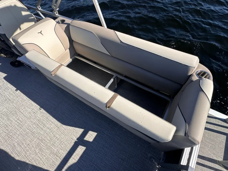 Slide: The Image of 2025 Tahoe Pontoon Sport 85 Quad Lounger with beige seating on a boat deck. - 9