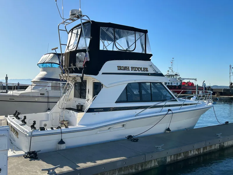 Slide: The Image of Riviera 34 Convertible yacht docked at marina, 2000 model, sunny day. - 10