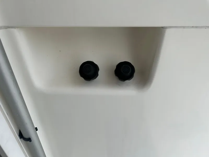 Slide: The Image of Close-up of Riviera 34 Convertible 2000 boat controls on a white panel. - 33