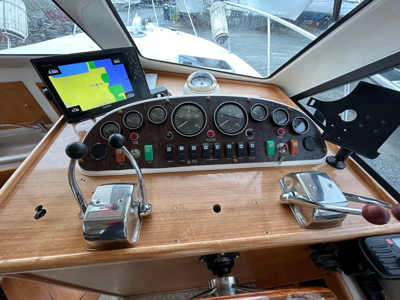 Slide: The Image of Control panel of a 2000 Riviera 34 Convertible boat with navigation instruments. - 37