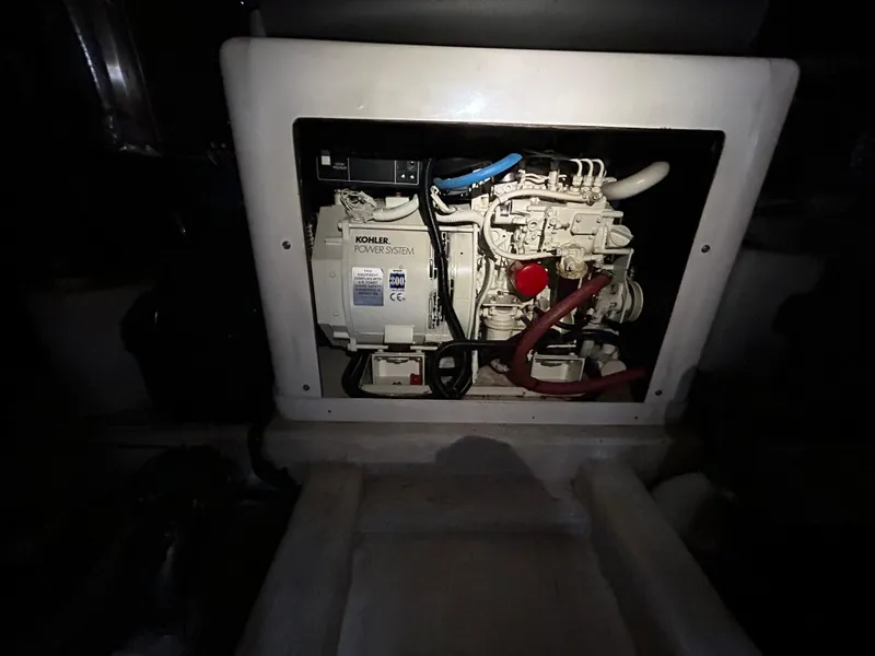 Slide: The Image of Engine compartment of 2000 Riviera 34 Convertible with Kohler generator. - 43