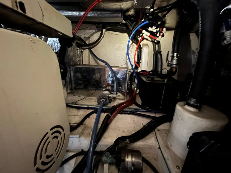 Slide: The Image of Engine room of 2000 Riviera 34 Convertible with visible wiring and components. - 44