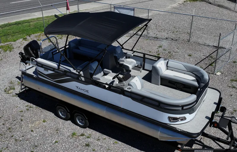 The Image of 2025 Tahoe Pontoon Sport 85 Quad Lounger with canopy, parked on a trailer. - 0