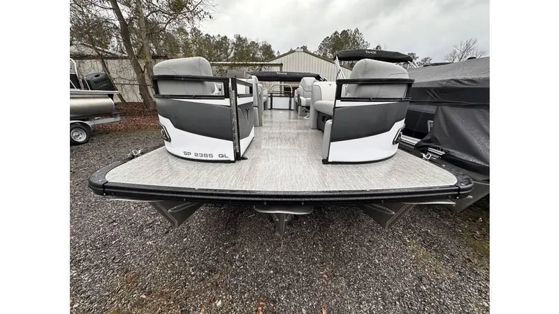 Slide: The Image of 2025 Tahoe Pontoon Sport 85 Quad Lounger, rear view, parked outdoors. - 6