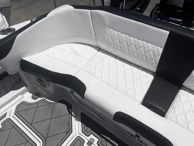 Slide: The Image of 2022 Nor-Tech 390 Sport Center Console with luxurious white and black seating. - 12