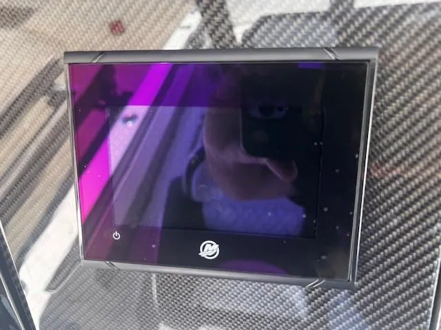 Slide: The Image of Touchscreen display on 2022 Nor-Tech 390 Sport Center Console boat dashboard. - 23