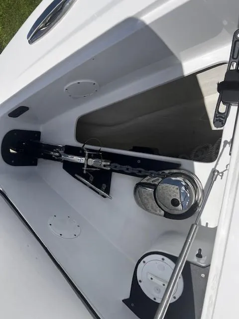 Slide: The Image of 2022 Nor-Tech 390 Sport Center Console anchor compartment with chain and winch system. - 28