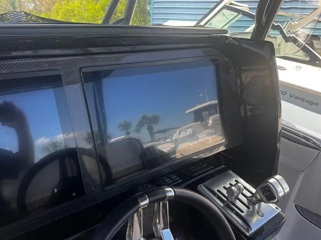 Slide: The Image of 2022 Nor-Tech 390 Sport Center Console dashboard with modern controls and touchscreen display. - 7