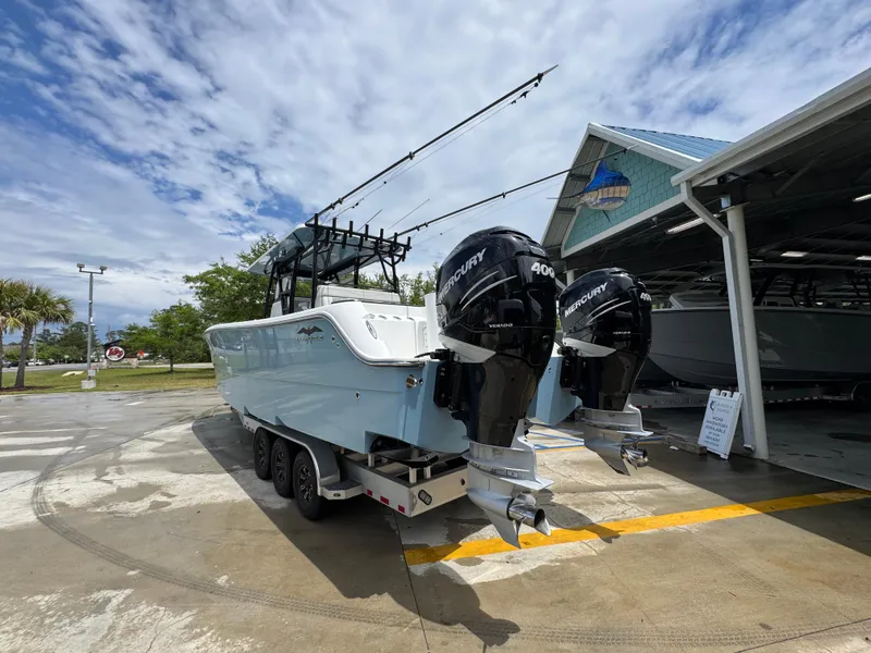 Slide: The Image of 2022 Invincible 33 Catamaran with twin Mercury engines on a trailer. - 17